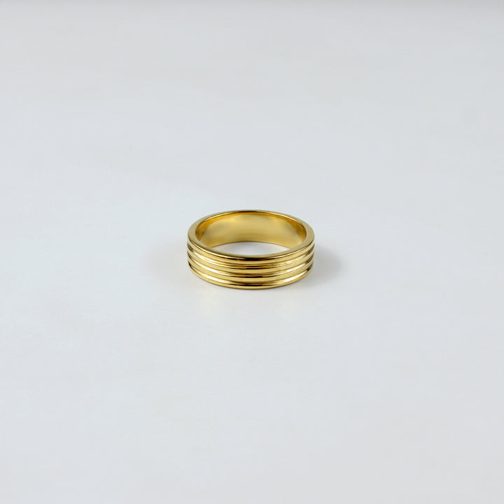 An elegant ring crafted from premium brass and plated with 18k gold for a luxurious finish. The minimalist circular design exudes sophistication and modern charm, making it a versatile piece suitable for any occasion.